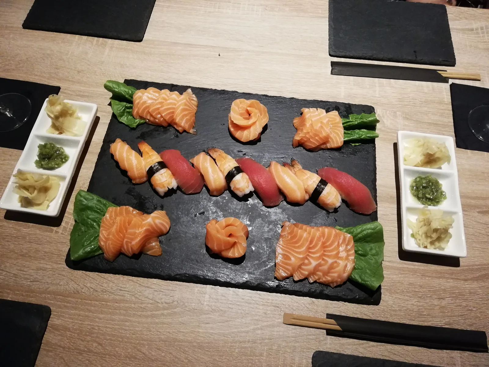 A slate of salmon and tuna sushi at a sushi restaurant in Prague.