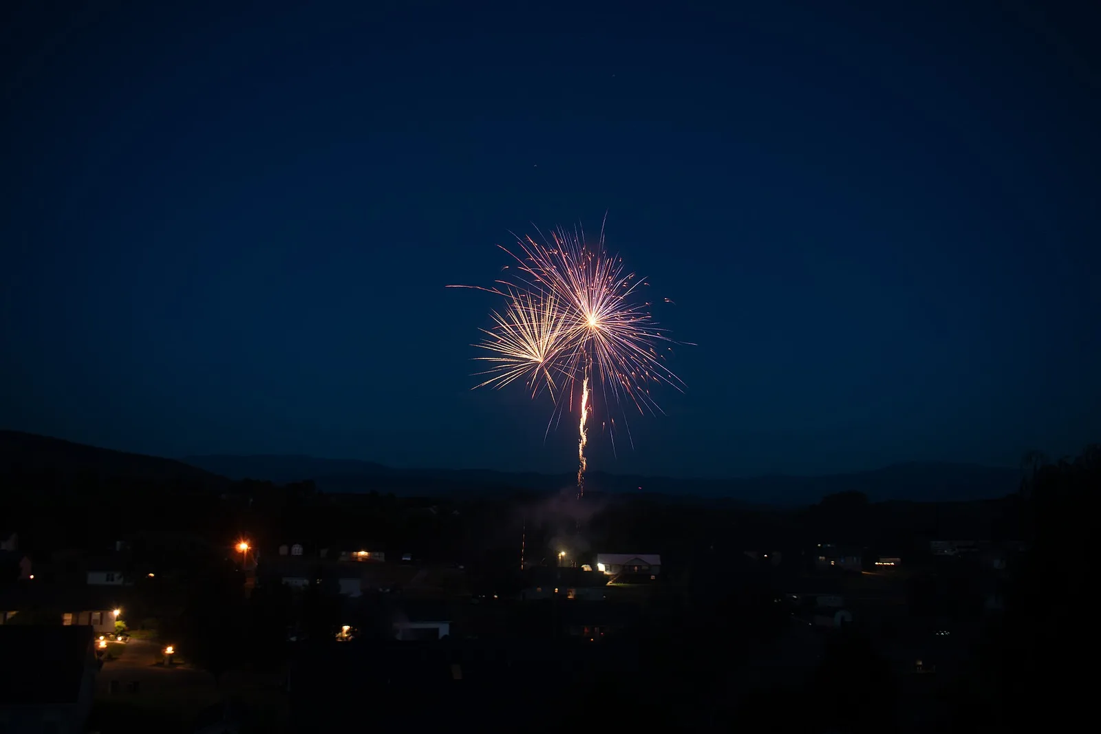 Red and gold fireworks burst over Sevierville, Tennessee, during its Independence Day show.