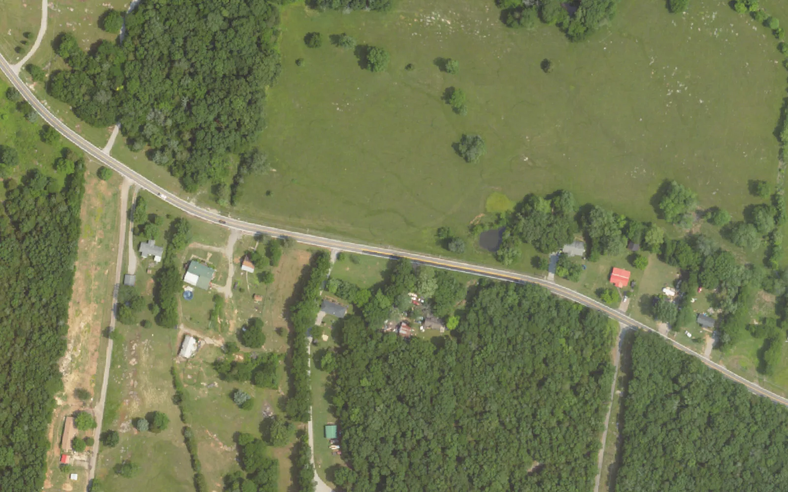 Pasture and woods along Central Pike near the Central Pike Elementary site southeast of Mount Juliet, seen from the air in 2023, before the school was built.