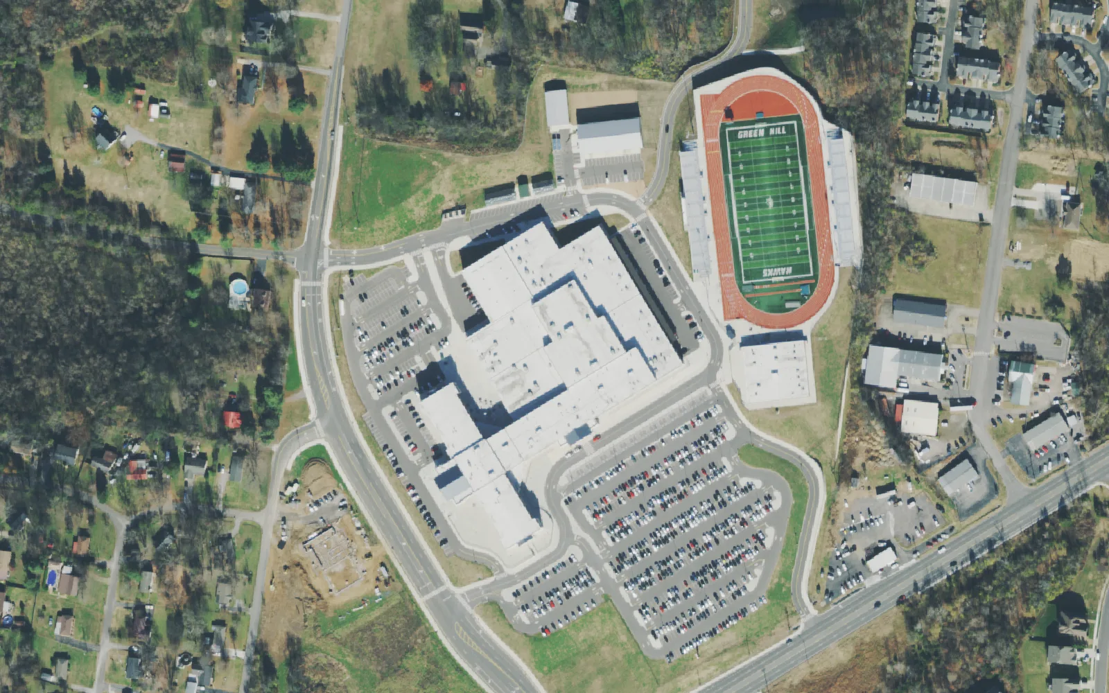 Green Hill High School's building, parking lots and football stadium off North Greenhill Road in Mount Juliet, seen from the air.