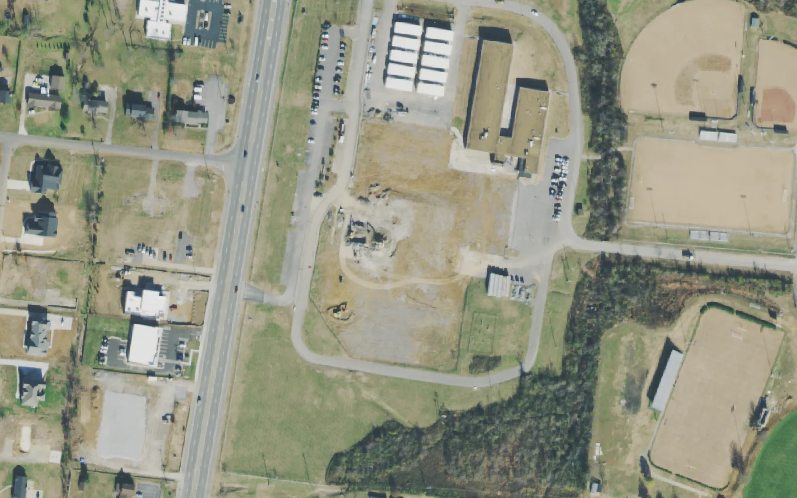 West Wilson Middle School's campus on North Mt. Juliet Road, with portable classrooms and a cleared site beside the main building, seen from the air in 2021.